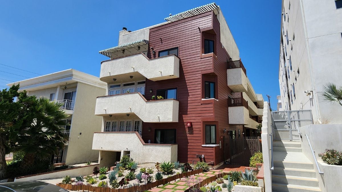 Contemporary apartment building with colorful facade panels and modern urban housing design