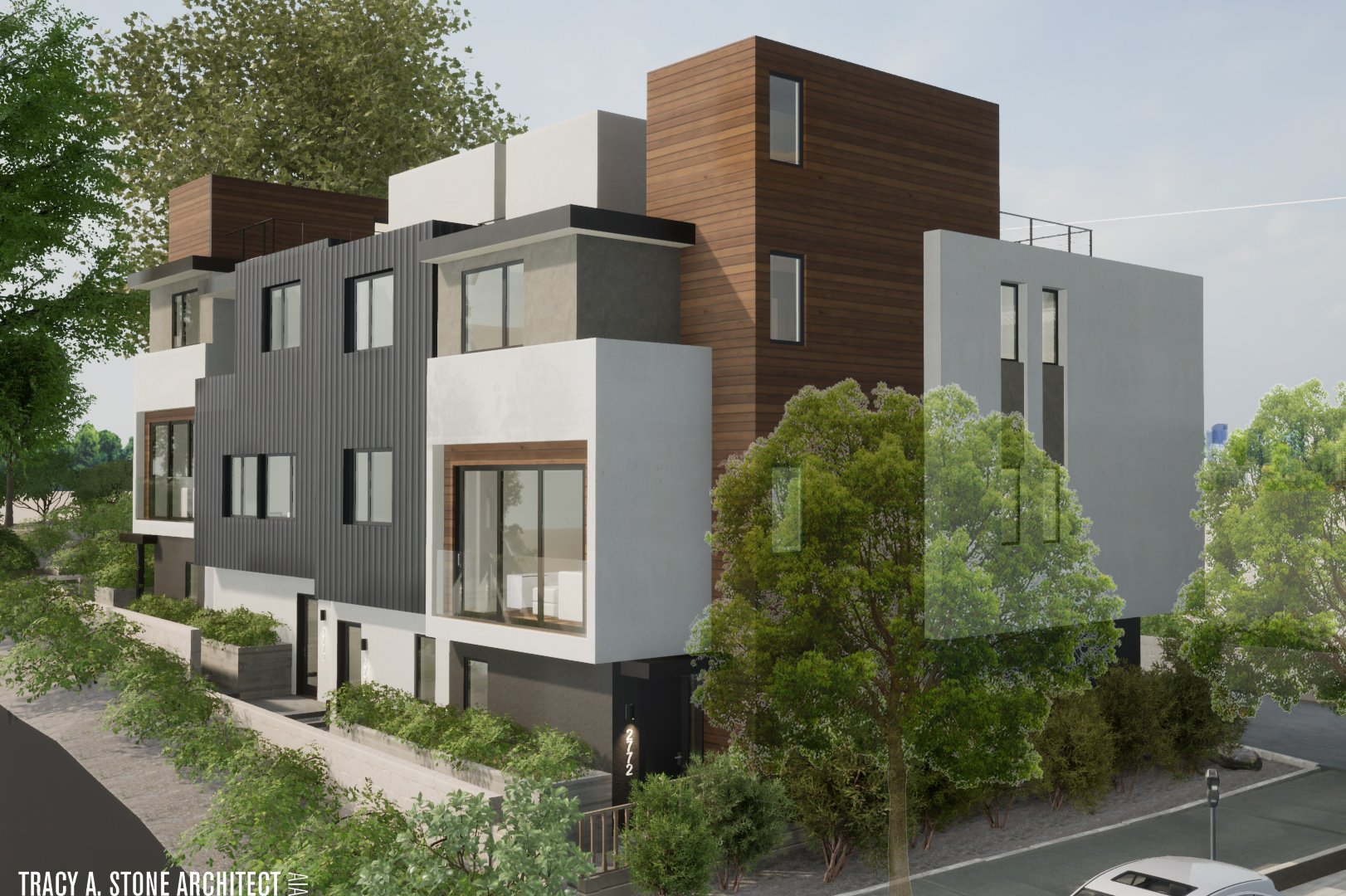 Contemporary multifamily building with brown wood accents and white panels.