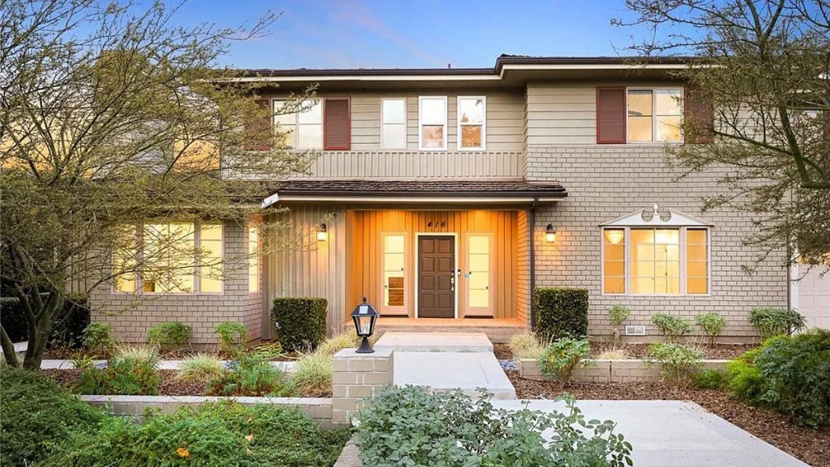 Traditional two-story California home with landscaped front yard and symmetrical architecture