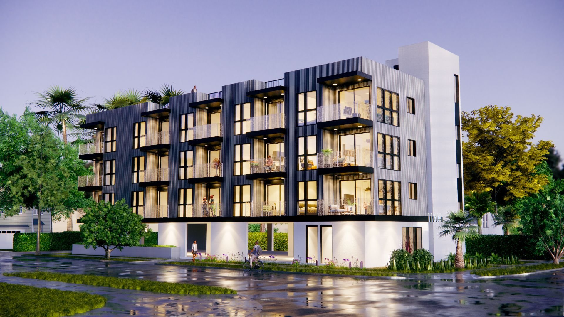Modern black apartment complex with balconies overlooking landscaped grounds.